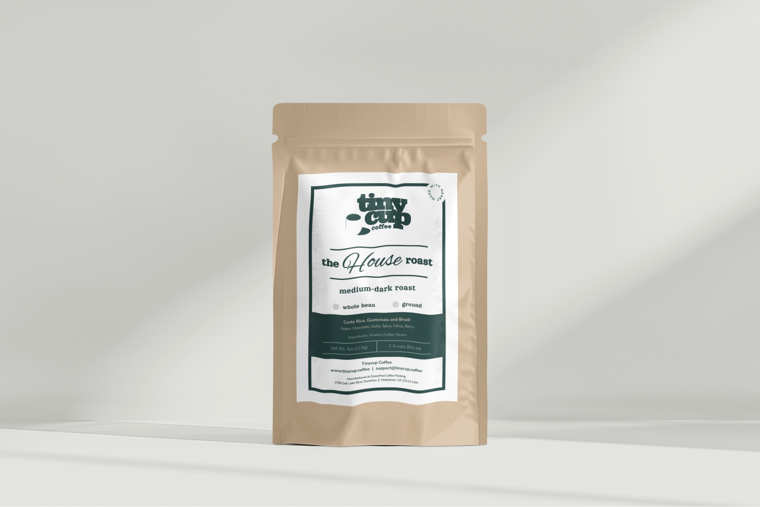 A beige package of The House Roast coffee with a label that includes the brand name and product description.